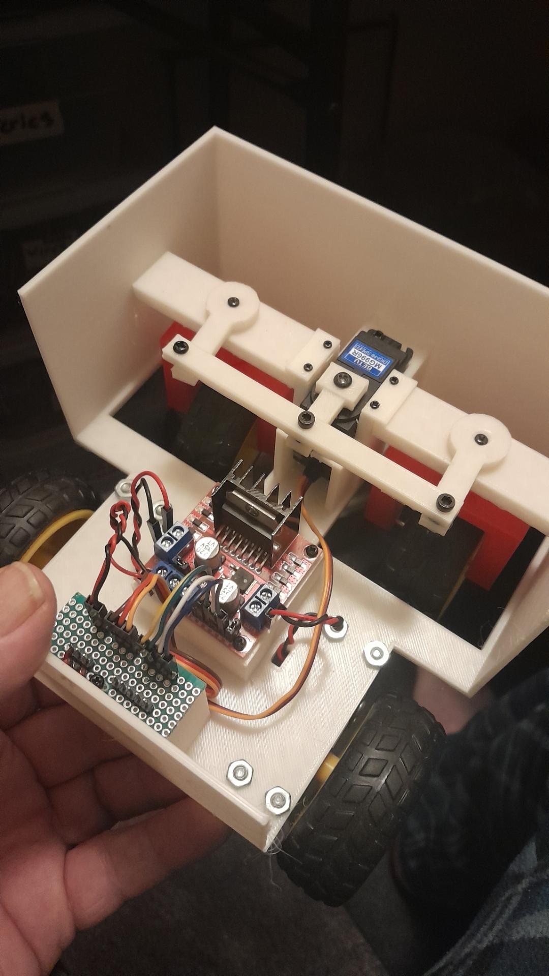 White box with wheels and a servo for steering