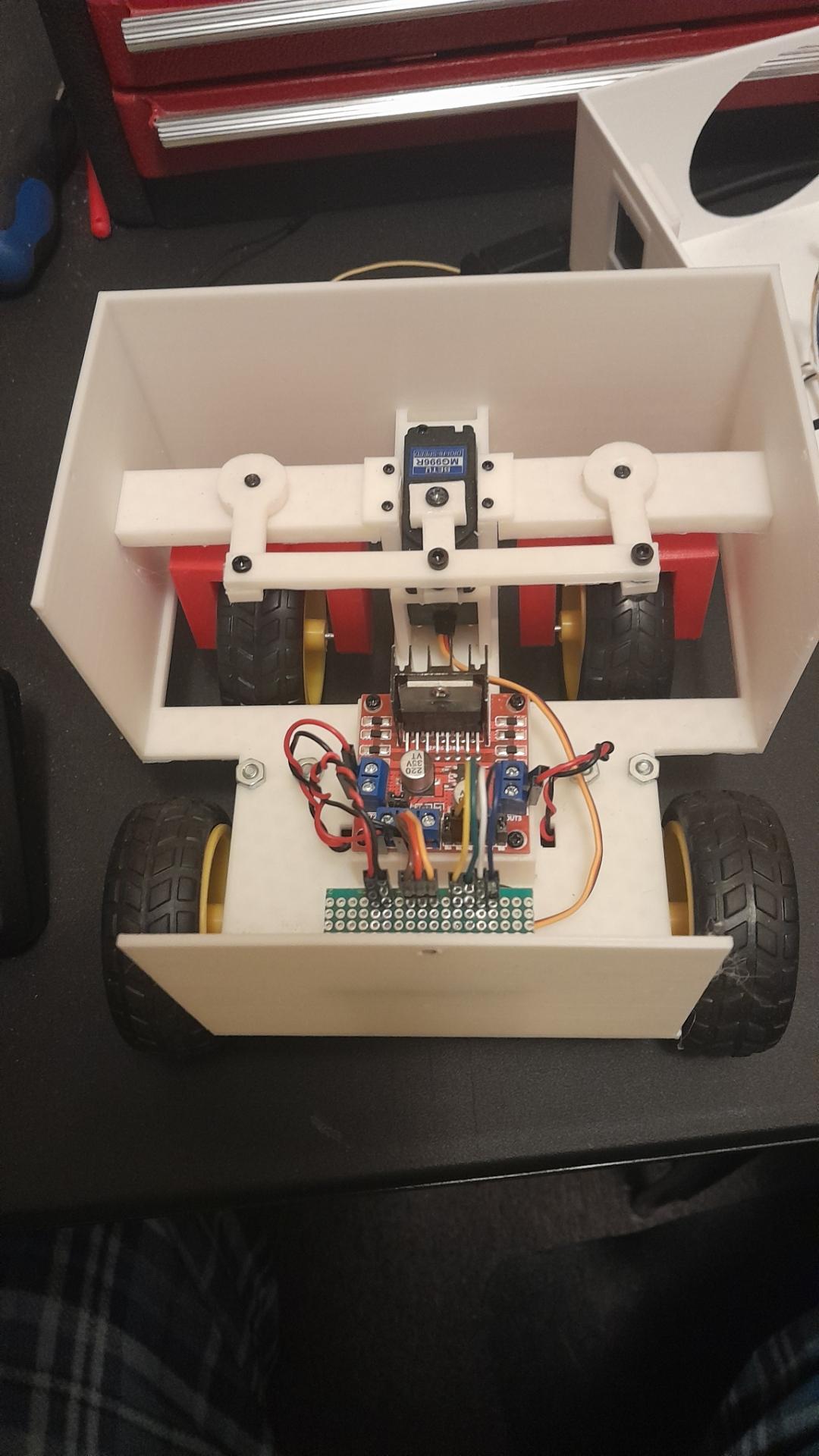 White box with wheels and a servo for steering