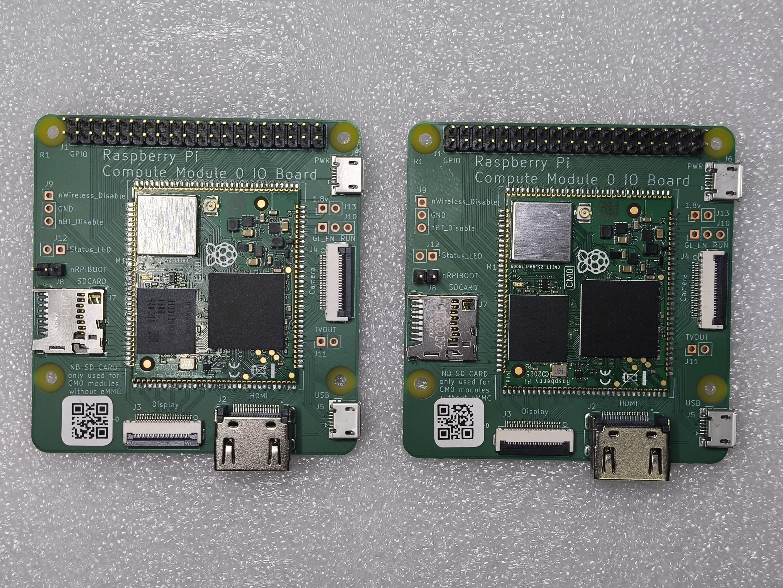 Two Raspberry Pi compute module zero on development boards side by side.