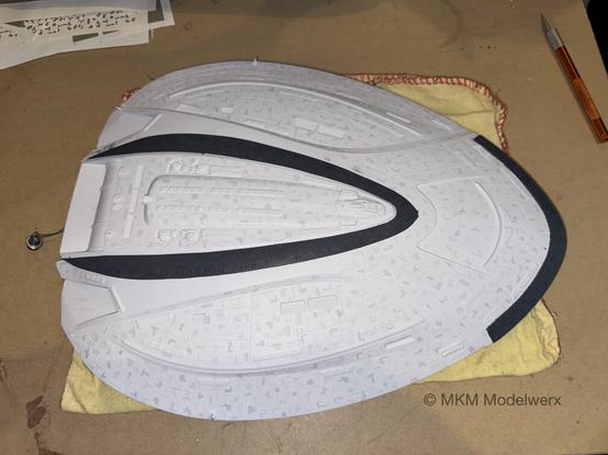 Dark grey bands painted on the top of the saucer.