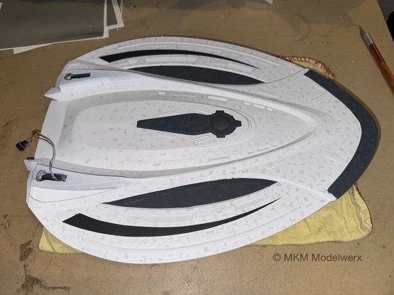 Dark grey bands painted on the bottom of the saucer section.