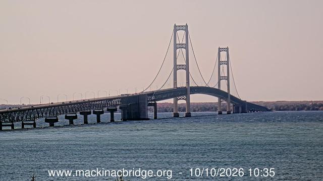 Southern view from Bridge View Park on the shore of Lake Michigan of the Mackinac Bridge traversing the Straits of Mackinac. // Image captured at (local time): 2026-10-10 10:36:02 EDT (about 1 min. prior to this post) // Image sourced from: mackinacbridge.org // Current Temp in St. Ignace: 58 F | 14 C // Precip: clear sky // Wind: ESE at 15 mph | 24 kph // Humidity: 76%