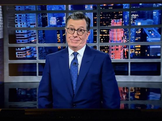 A screenshot of the Tonight Show with Stephen Colbert featuring Stephen making a quirky face. The photo is from the final episode May 21, 2026.