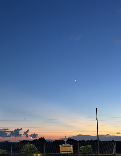 A sunset view, with the moon and venus in the sky
